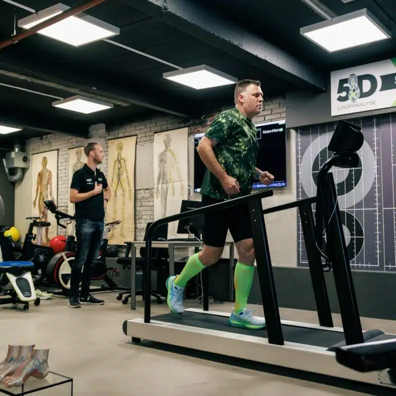 Customer on the treadmill for a pre-running gait analysis at one of the RunX stores