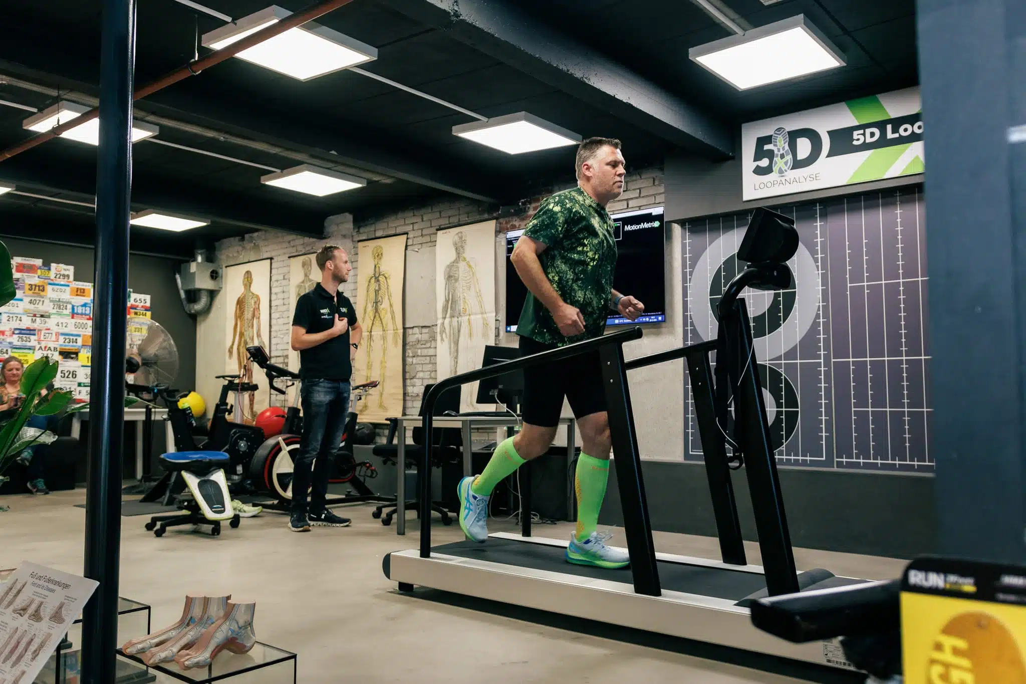 Customer on the treadmill for a pre-running gait analysis at one of the RunX stores